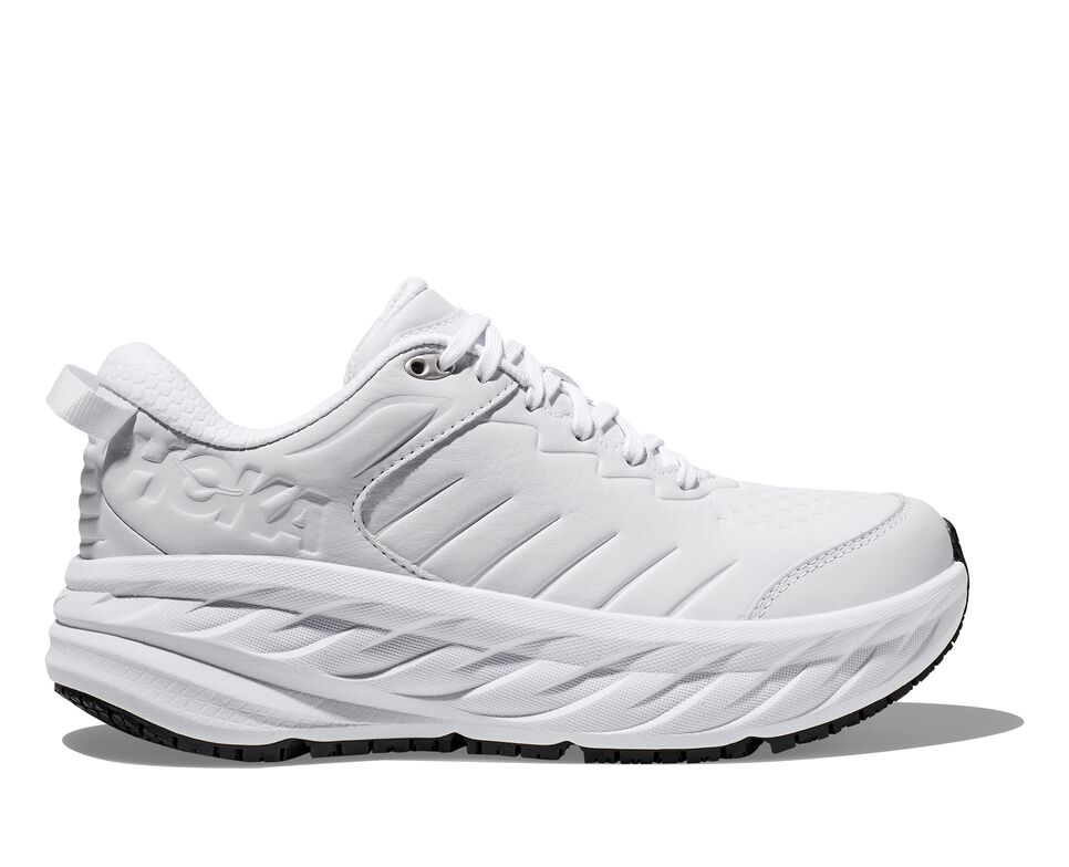 A white lace-up tennis shoe with an extra-supportive sole.