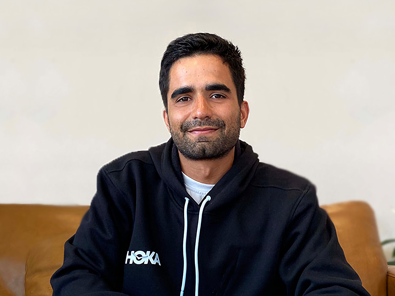 Gabe Nicasio smiling wearing HOKA