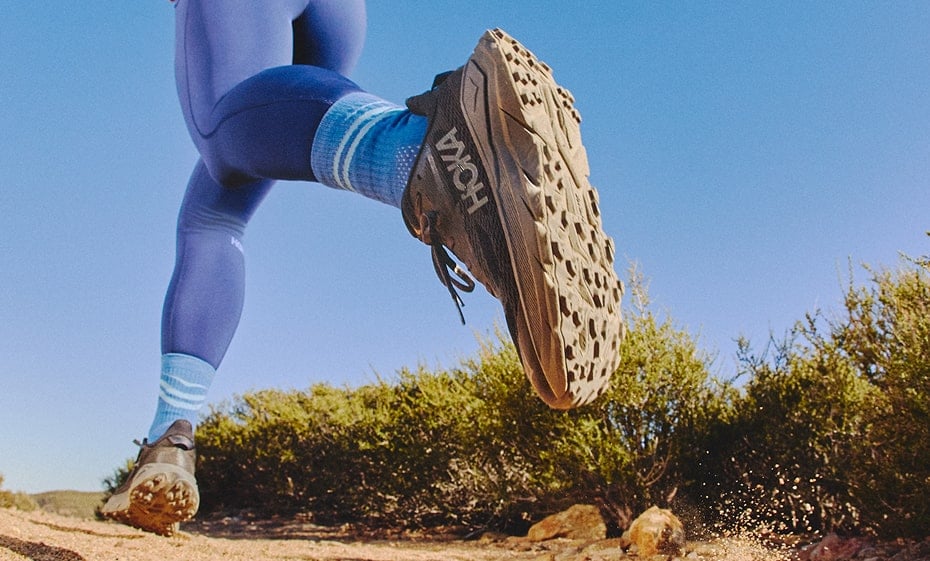 Close-up to a person wearing HOKA Challenger 8