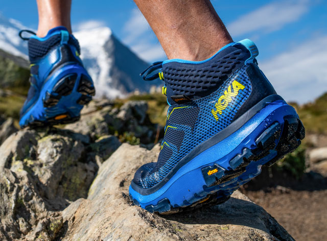 A man hiking on rocks