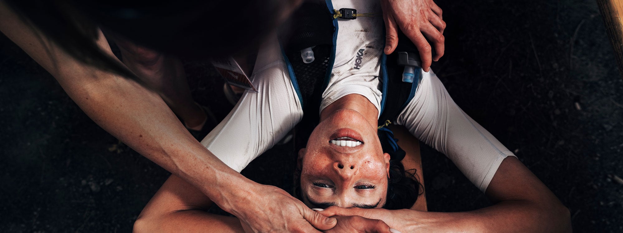 HOKA runner laying down after a grueling race.