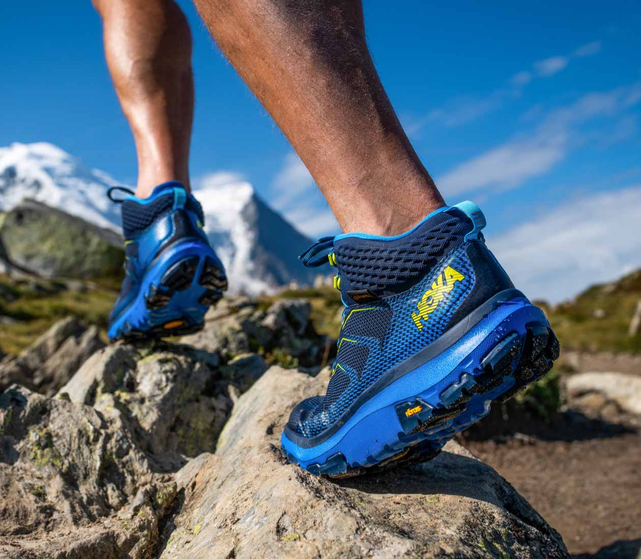 A man hiking on rocks